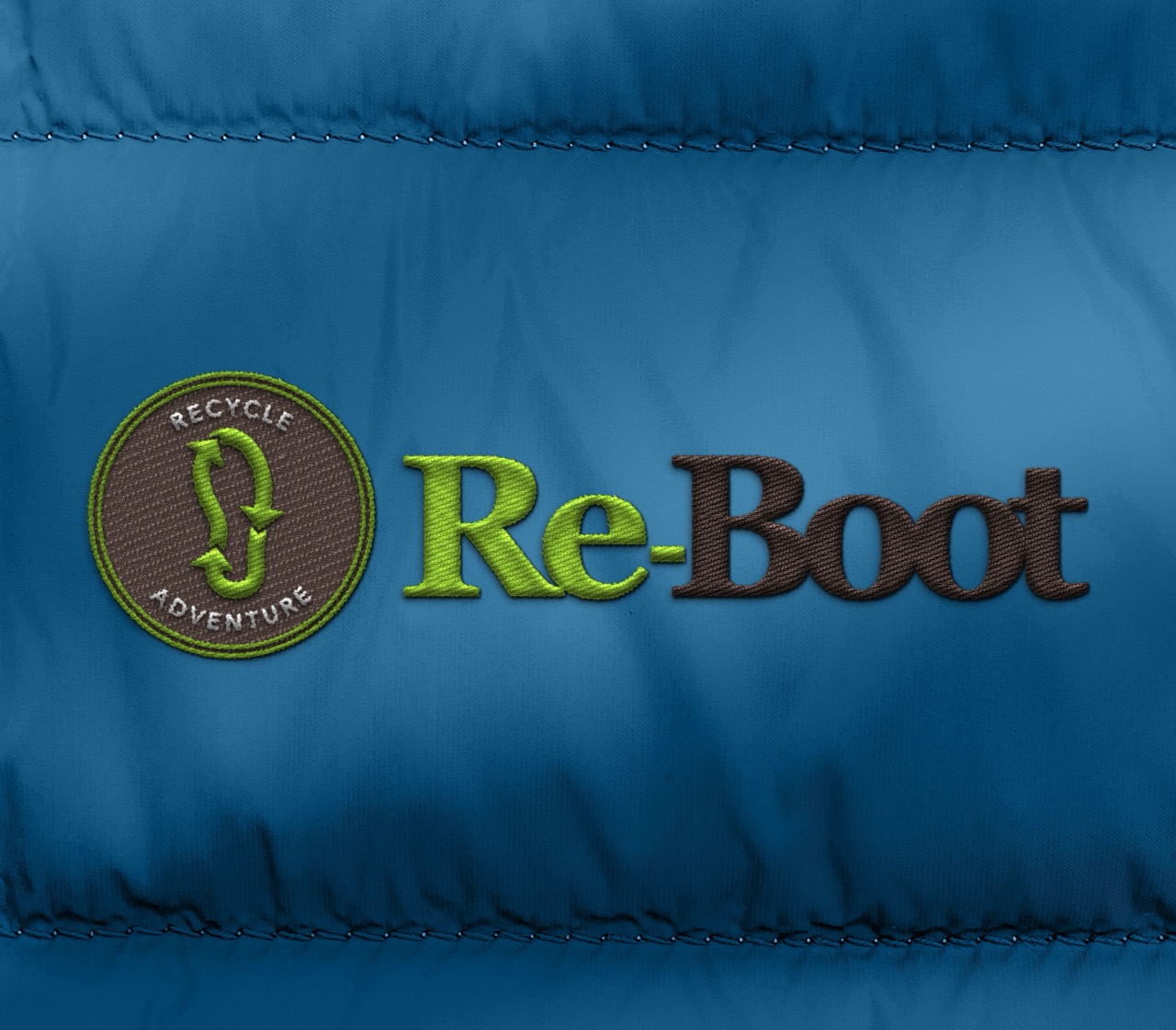 Re-Boot logo embroidered on a blue jacket