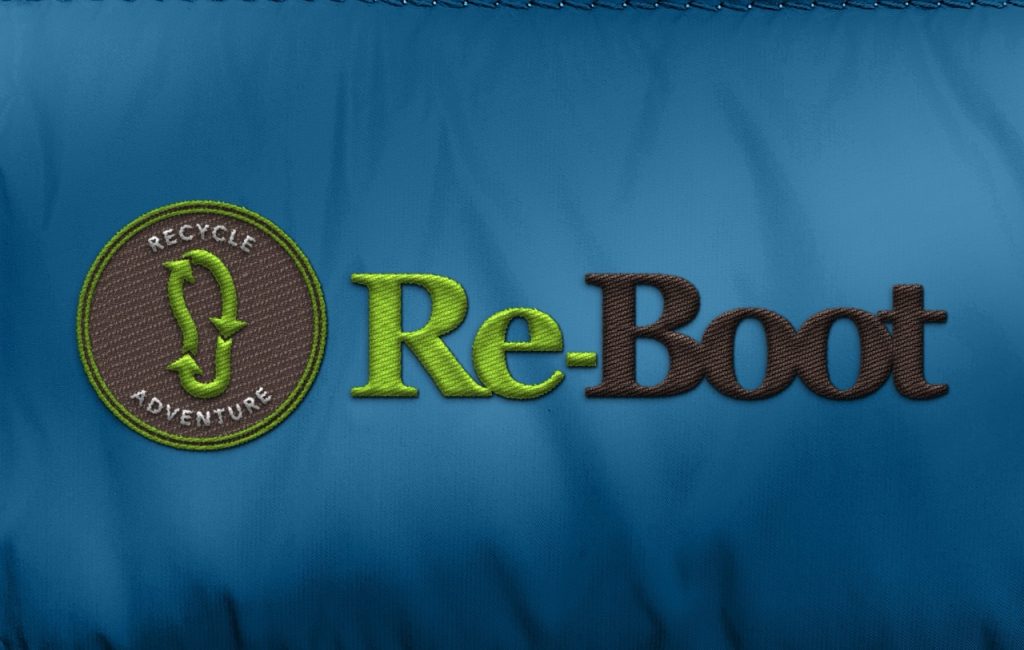 Re-Boot logo embroidered on a blue jacket